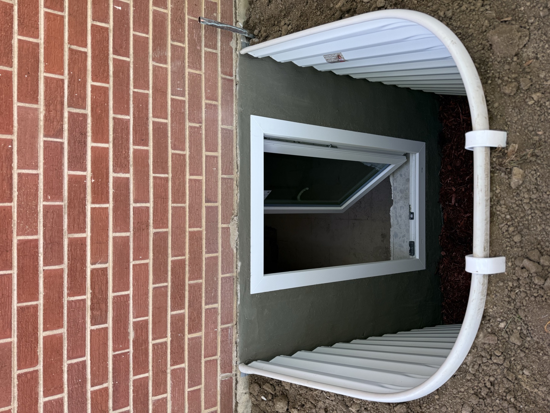 Egress window open casement exterior view Denver CO